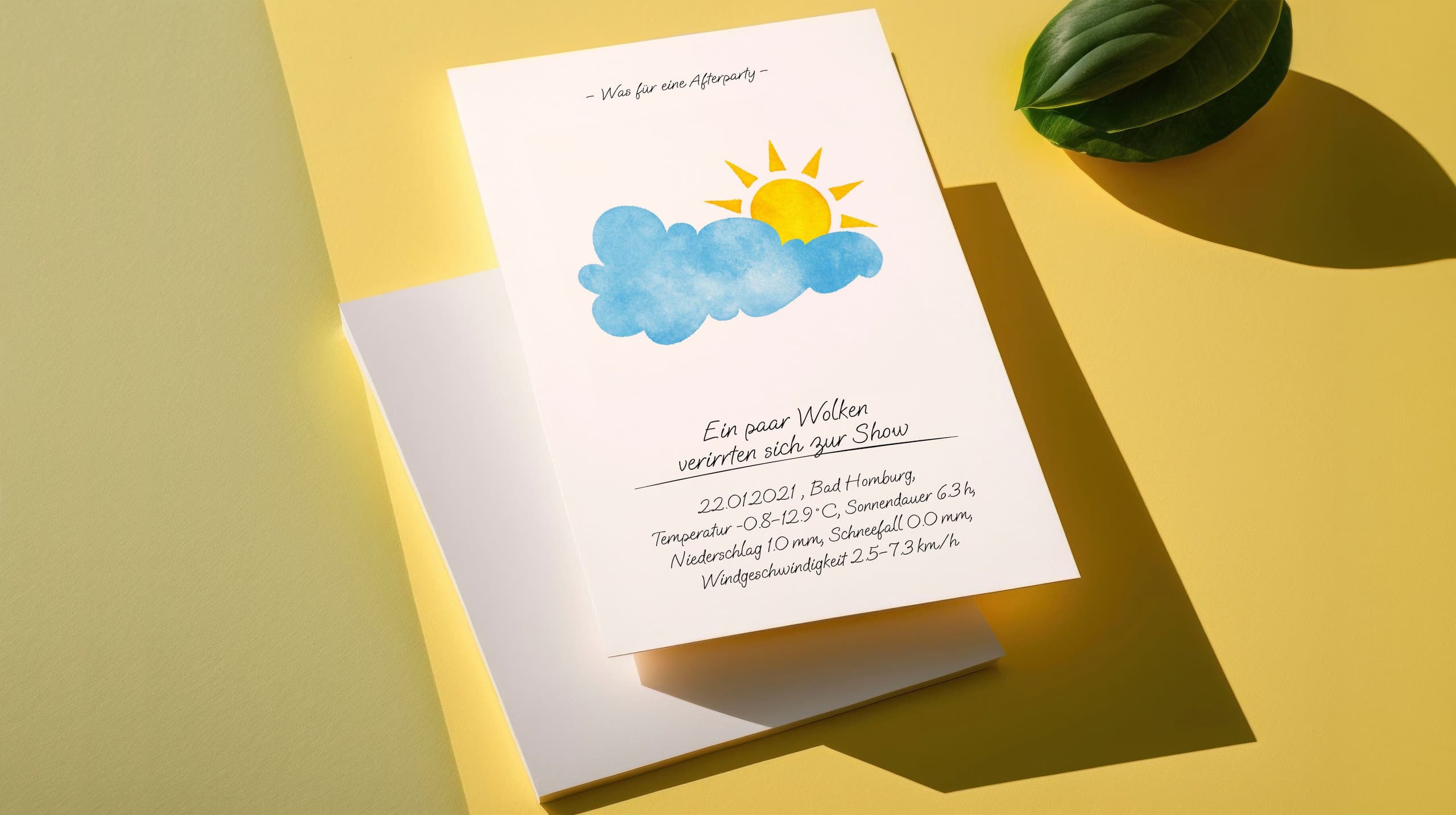 Product mood shot of a card with a watercolour cloud and sun